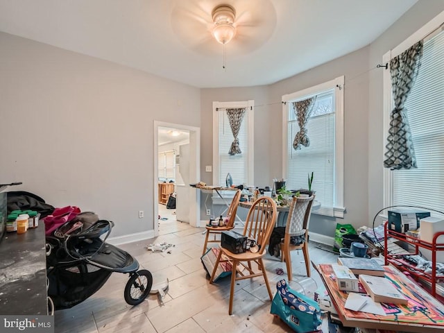 dining room featuring light tile patterned floors and ceiling fan