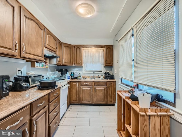 kitchen with white range with electric stovetop, sink, light tile patterned floors, and exhaust hood