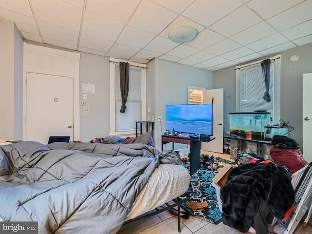 bedroom featuring a paneled ceiling