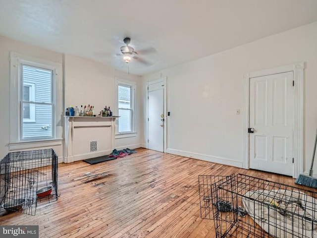 interior space with light hardwood / wood-style flooring and ceiling fan