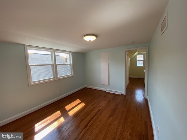 spare room with dark hardwood / wood-style flooring