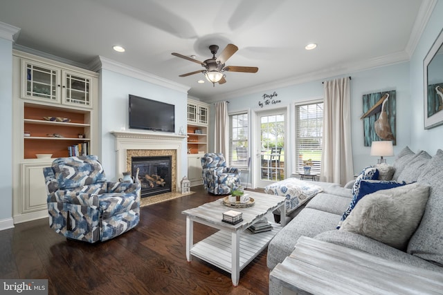 living room with crown molding, ceiling fan, and dark hardwood / wood-style flooring