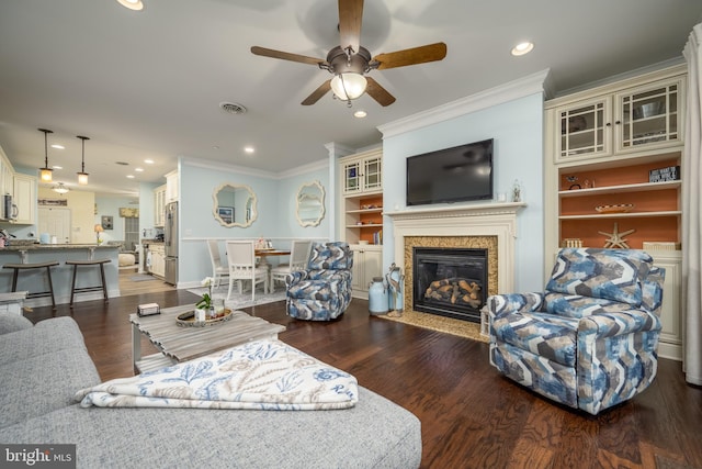 living room featuring crown molding, ceiling fan, and dark hardwood / wood-style flooring