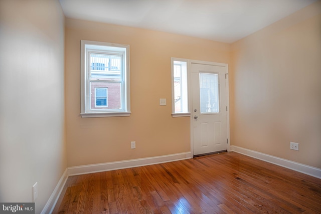 spare room with dark wood-type flooring