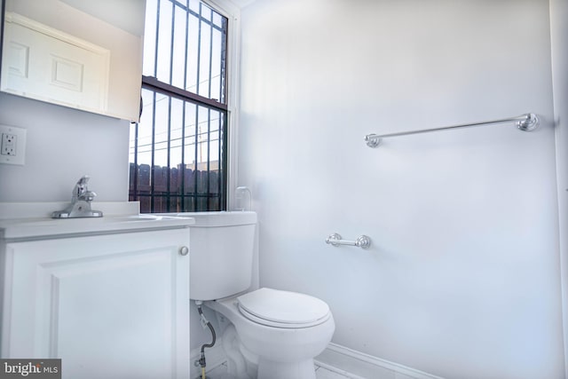 bathroom with toilet and vanity