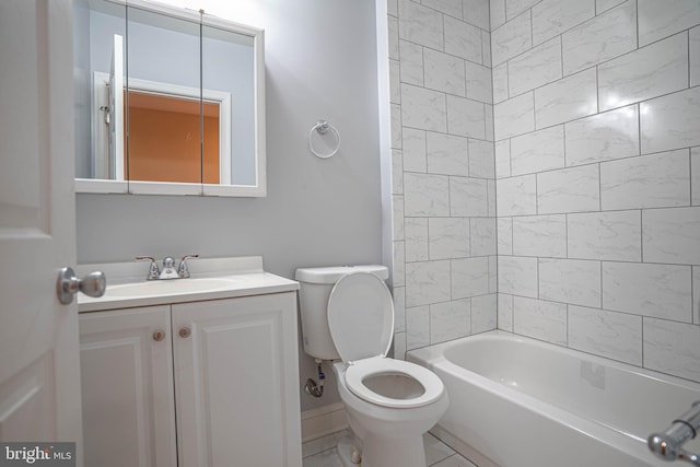 full bathroom with toilet, vanity, tiled shower / bath, and tile flooring