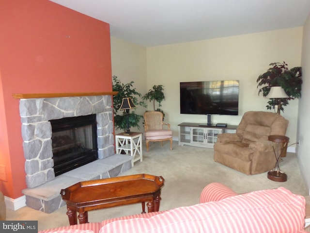 carpeted living room with a fireplace