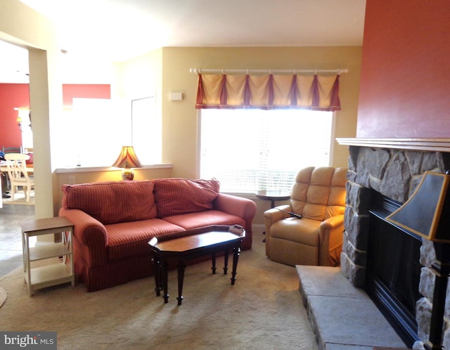 carpeted living room with a fireplace