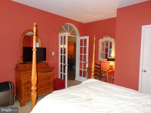 carpeted bedroom featuring french doors