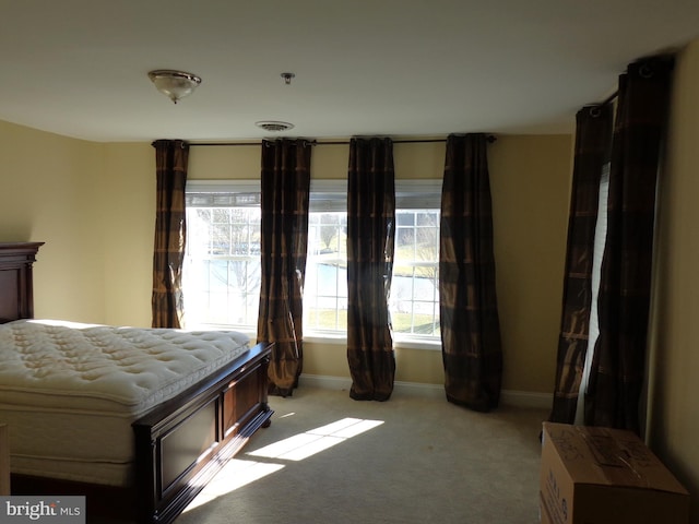 unfurnished bedroom featuring light carpet