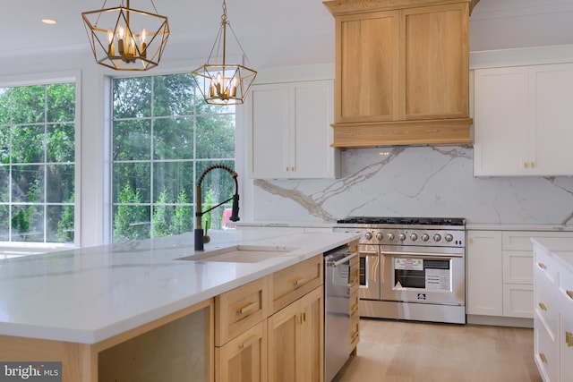 5824 Wild Lilac Dr, Lot East Petersburg, PA 17520 - kitchen with a chandelier, a sink, range with two ovens, light stone counters, and backsplash