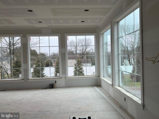 unfurnished sunroom with a healthy amount of sunlight