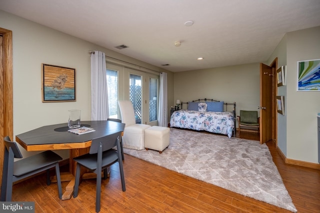 bedroom with light hardwood / wood-style flooring and access to exterior