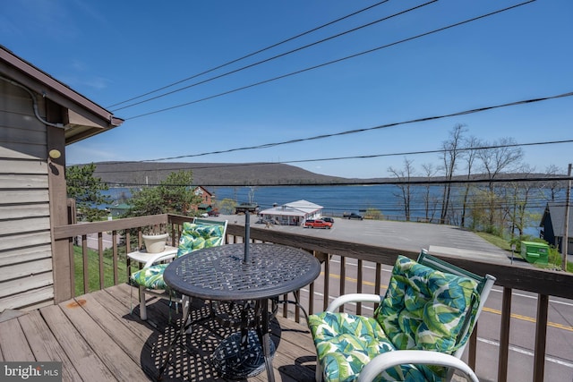 deck featuring a water view