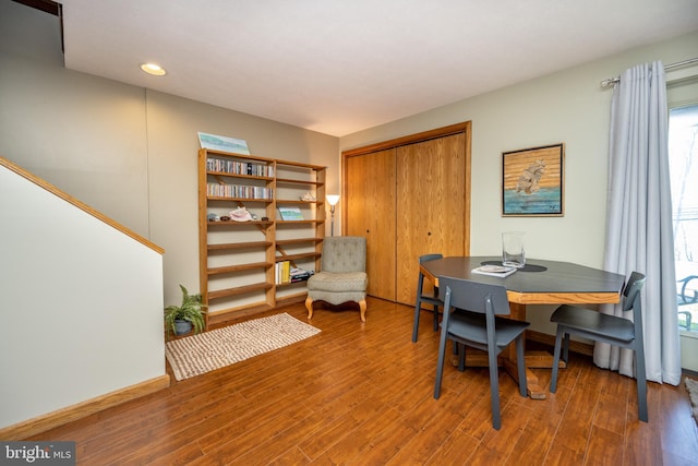 home office with dark hardwood / wood-style floors