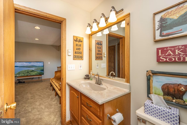 bathroom featuring toilet and vanity