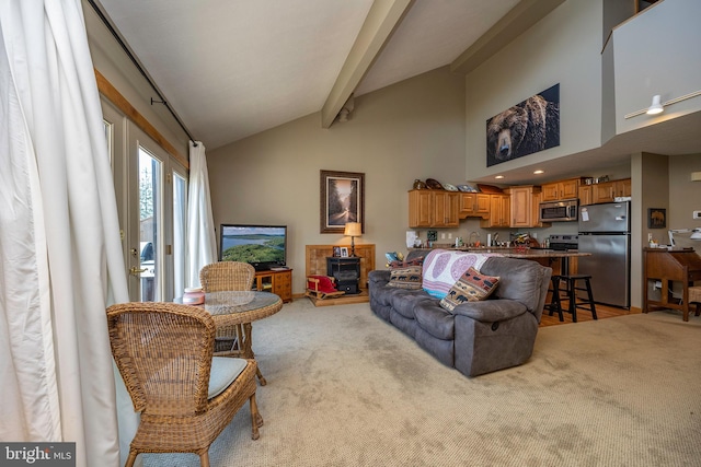 carpeted living room with high vaulted ceiling, sink, and beam ceiling