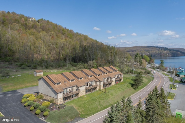 birds eye view of property with a water view