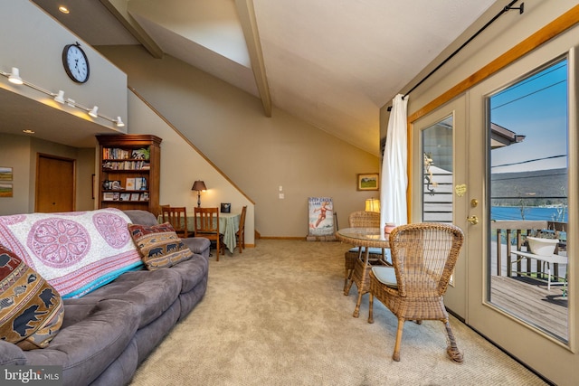 carpeted living room featuring vaulted ceiling with beams