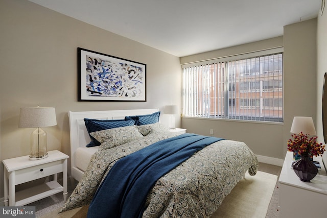 bedroom featuring light carpet