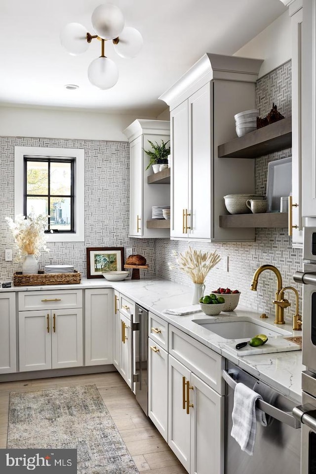 kitchen featuring backsplash and light stone countertops