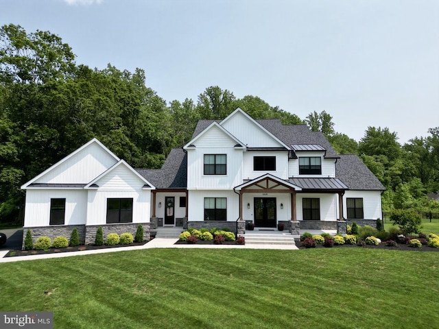 modern inspired farmhouse featuring a front lawn