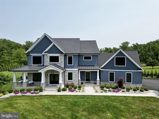 craftsman-style house with covered porch and a front yard