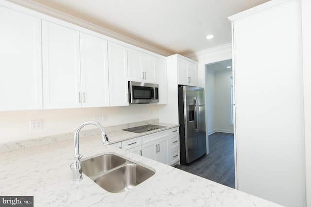 300 Dixon St Unit 202, Easton, MD 21601 - kitchen featuring appliances with stainless steel finishes, white cabinetry, light stone countertops, dark wood-style floors, and crown molding