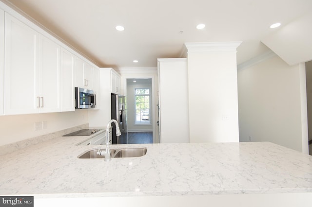 300 Dixon St Unit 202, Easton, MD 21601 - kitchen featuring stainless steel appliances, ornamental molding, light stone counters, white cabinets, and recessed lighting