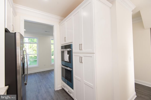 300 Dixon St Unit 202, Easton, MD 21601 - kitchen featuring appliances with stainless steel finishes, dark wood finished floors, white cabinets, light countertops, and crown molding