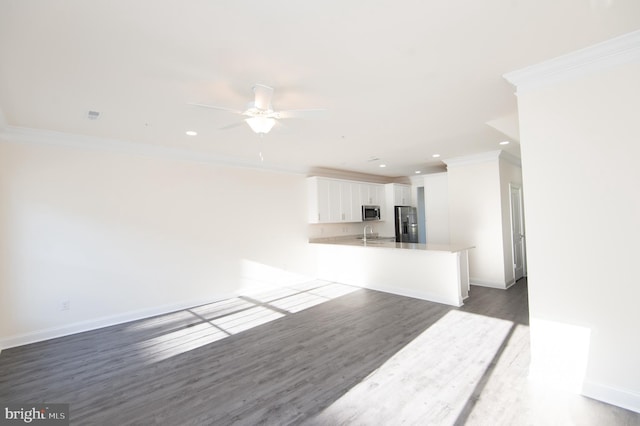 300 Dixon St Unit 202, Easton, MD 21601 - unfurnished living room featuring ornamental molding, recessed lighting, ceiling fan, and wood finished floors