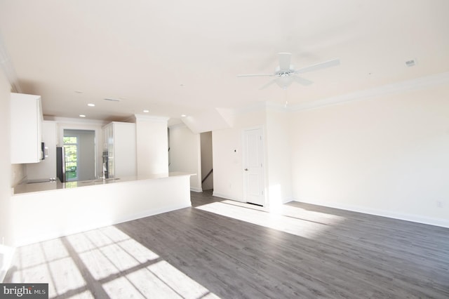 300 Dixon St Unit 202, Easton, MD 21601 - unfurnished living room with ornamental molding, dark wood-style floors, recessed lighting, and ceiling fan