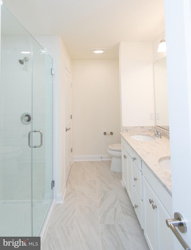300 Dixon St Unit 202, Easton, MD 21601 - bathroom with a shower stall, double vanity, and marble finish flooring