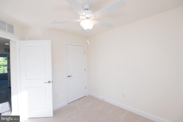 300 Dixon St Unit 202, Easton, MD 21601 - unfurnished bedroom featuring carpet floors and ceiling fan