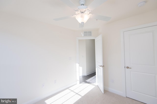 300 Dixon St Unit 202, Easton, MD 21601 - unfurnished bedroom featuring light colored carpet and a ceiling fan