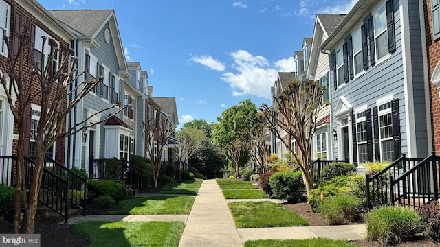 view of property's community with a yard