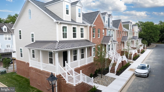 exterior space featuring covered porch and cooling unit