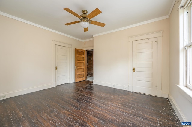 spare room featuring crown molding, dark wood-type flooring, and ceiling fan