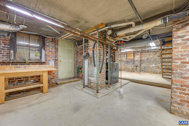 basement with brick wall