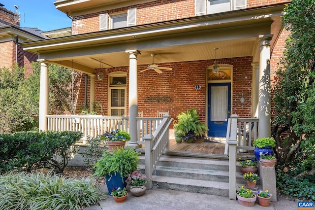 doorway to property featuring ceiling fan and covered porch