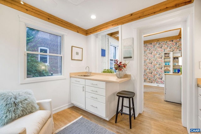 bathroom with vanity and hardwood / wood-style floors