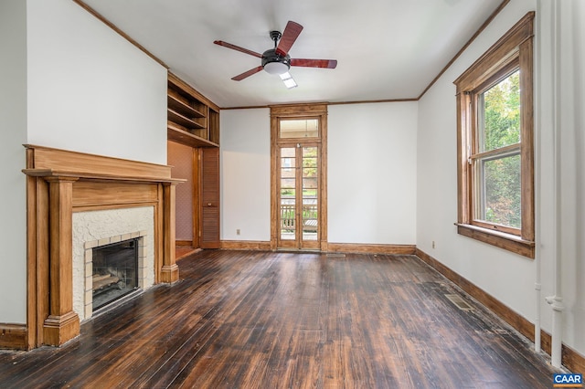 unfurnished living room featuring ceiling fan, dark hardwood / wood-style floors, and ornamental molding