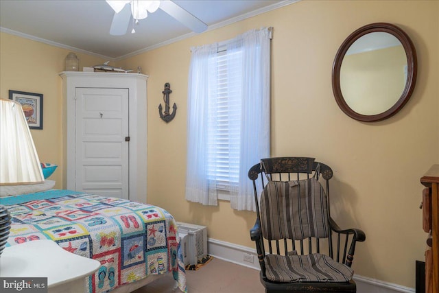 bedroom with ceiling fan and crown molding