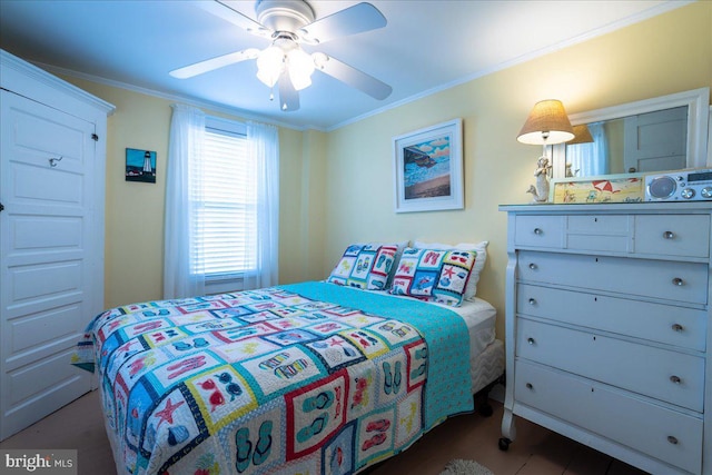 bedroom featuring ceiling fan and crown molding