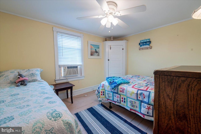 bedroom with ceiling fan, cooling unit, light hardwood / wood-style floors, and ornamental molding