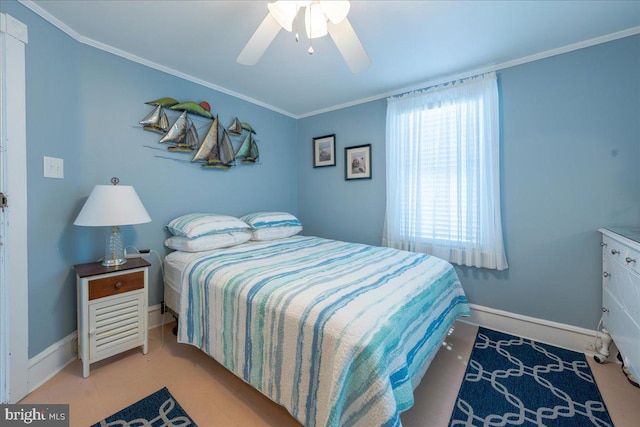 bedroom featuring ceiling fan and crown molding