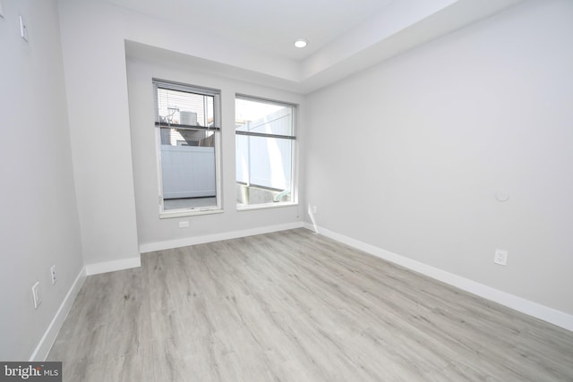 unfurnished room with light hardwood / wood-style floors