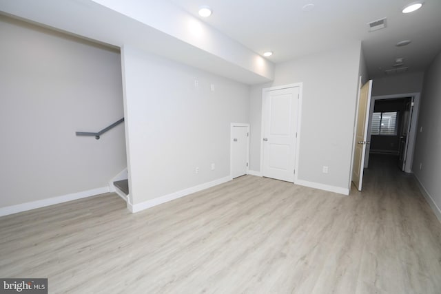 spare room with light hardwood / wood-style flooring