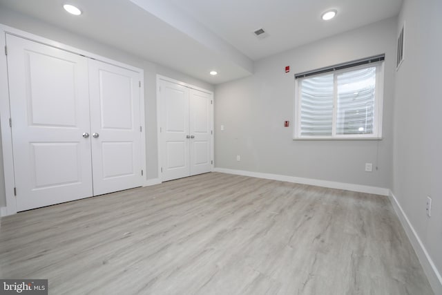 unfurnished bedroom with light hardwood / wood-style floors