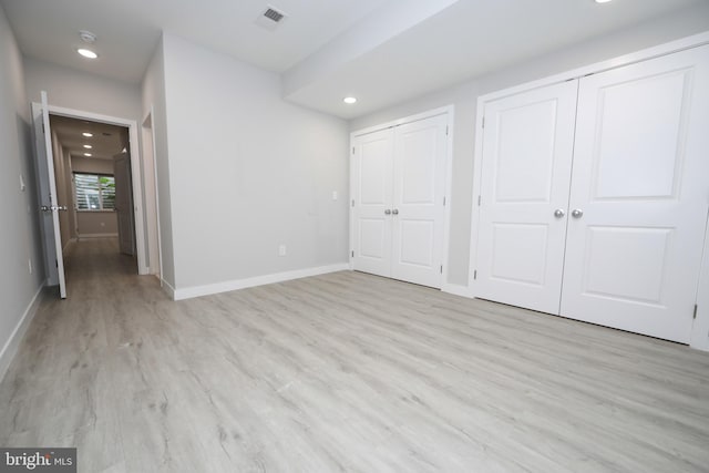 unfurnished bedroom with light hardwood / wood-style flooring